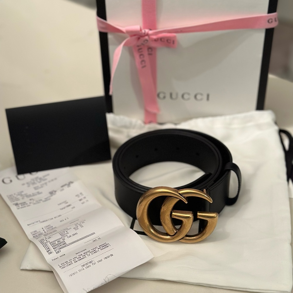 Slightly used Gucci Black and Gold Women's Belt